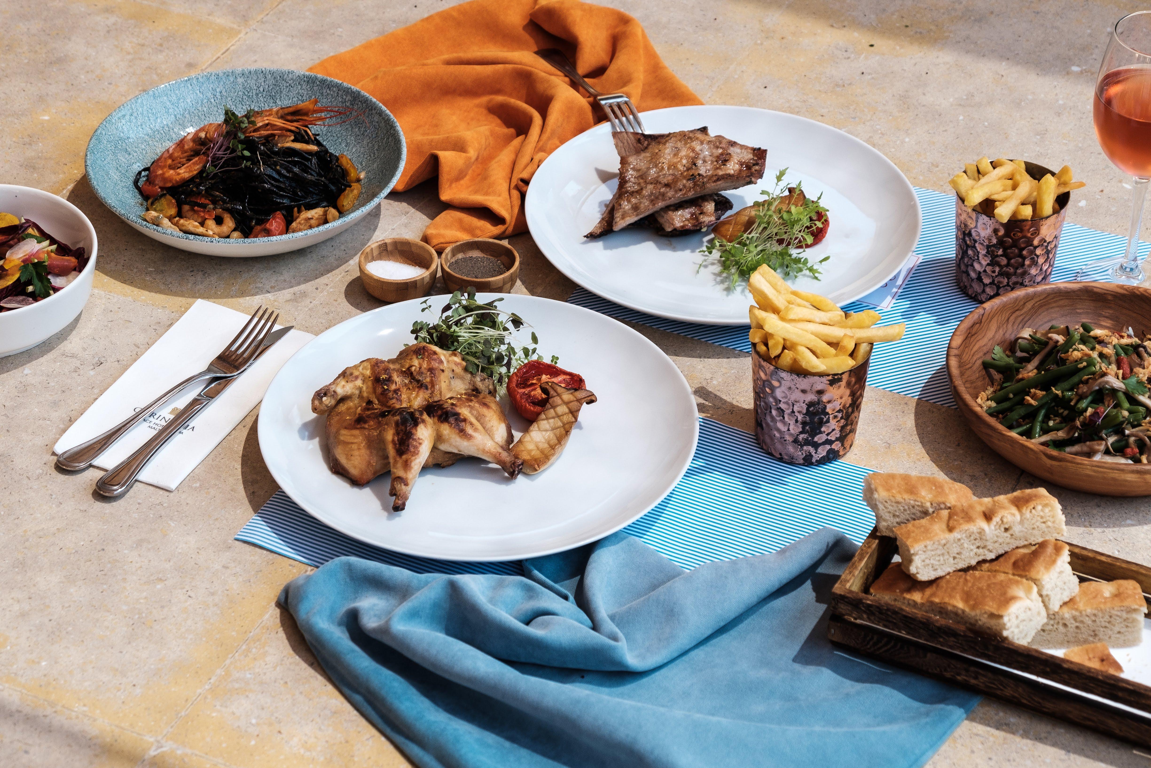 Corinthia Palace Malta Attard Exterior photo A selection of dishes from the restaurant